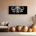 Bosveld buffalo art print by Hilde Alet Malan in a cherry wood frame, on a wall