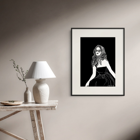 Content art print by Hilde Alet Malan in a black frame mount, on a wall