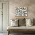 The gift of now print by Hilde Alet Malan, shown in a cherry frame in a room (frame not included)