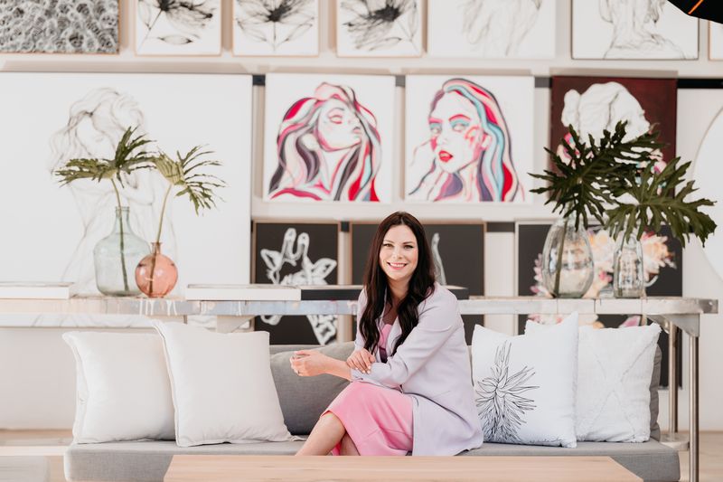 Hilde Alet Malan in her studio with her artworks